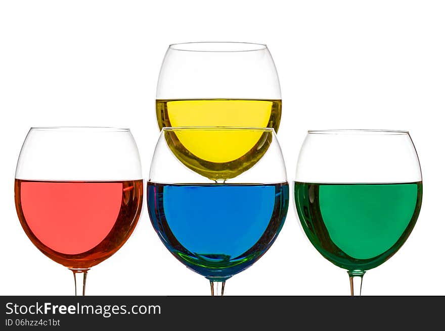 Colorful drinks in wine glasses