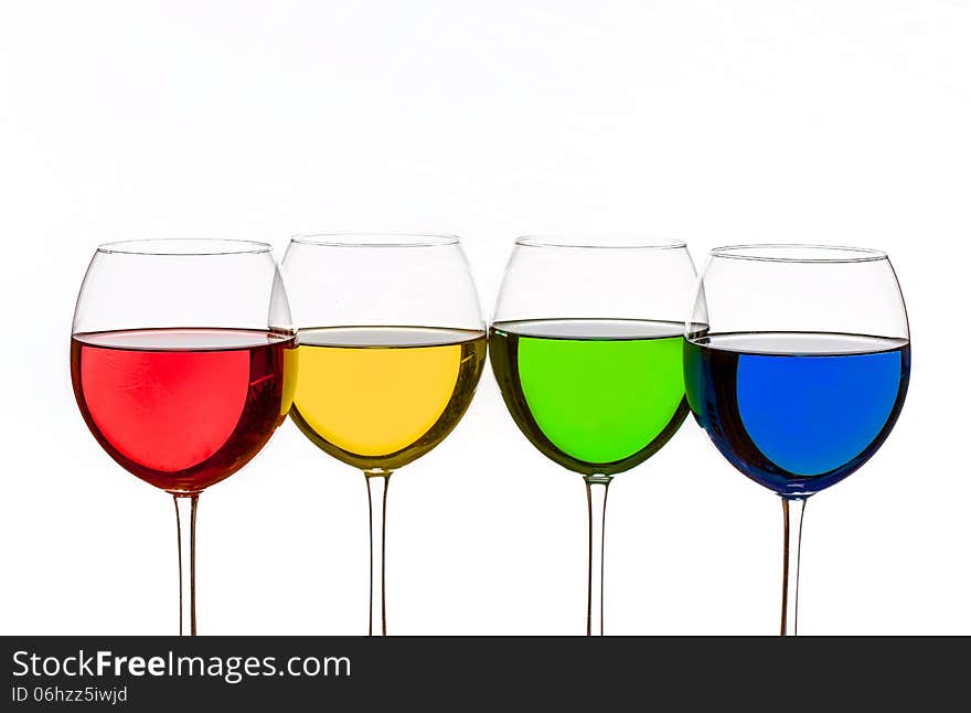 Colorful drinks in wine glasses