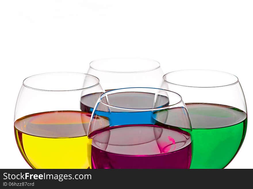 Colorful drinks in wine glasses