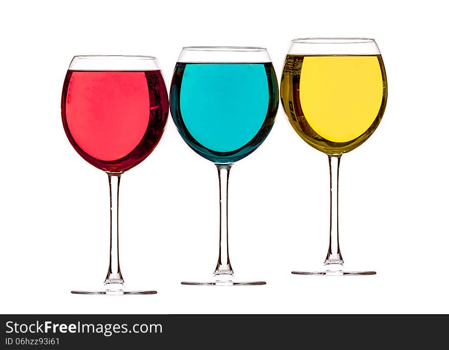 Colorful drinks in wine glasses