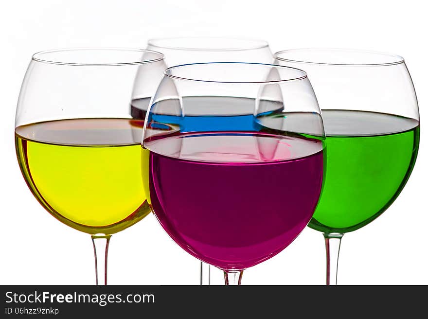 Colorful drinks in wine glasses