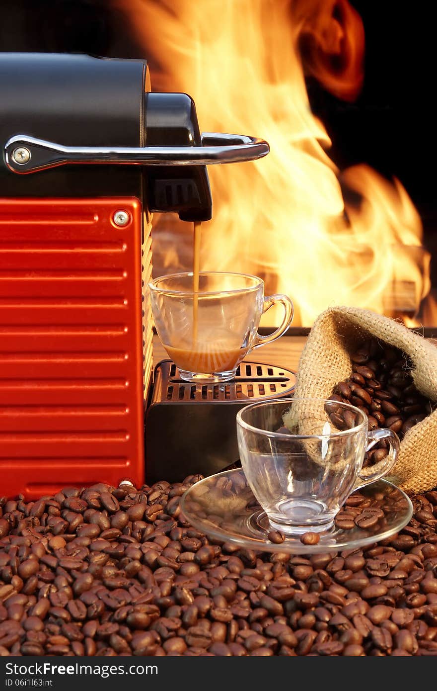 Coffee machine with two cups  of espresso and fire background