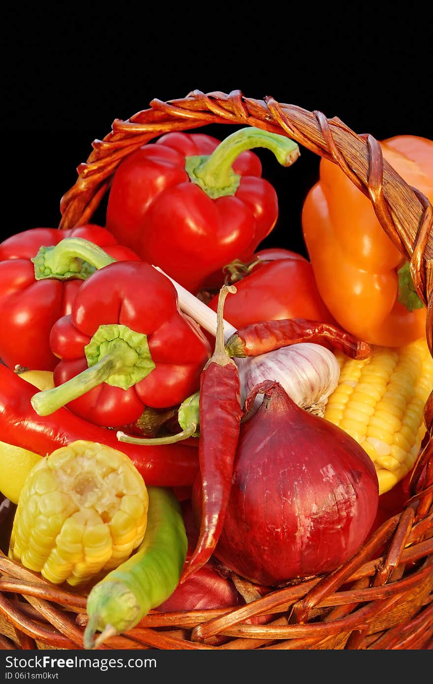 Wicker Basket with Vegetables on a Black Background XXXL. Wicker Basket with Vegetables on a Black Background XXXL