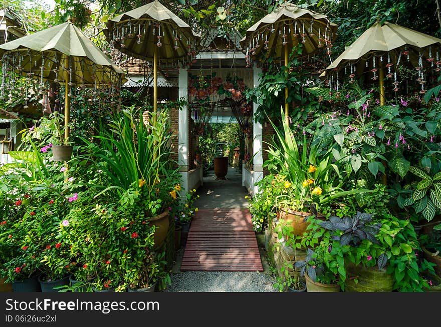 Beautiful garden entrance - natural open corridor in botanic park