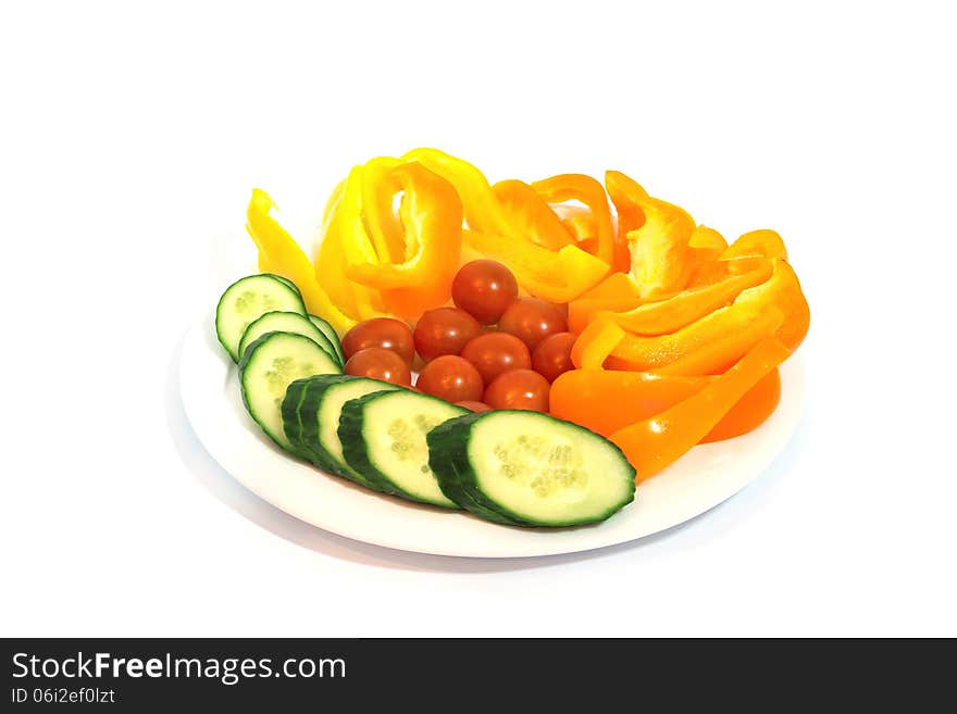 Plate with vegetables isolated on white