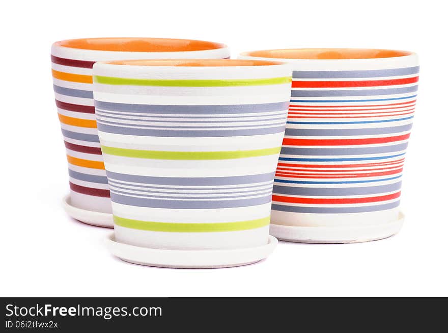 Arrangement of Three Empty Striped Flower Pots isolated on white background. Arrangement of Three Empty Striped Flower Pots isolated on white background