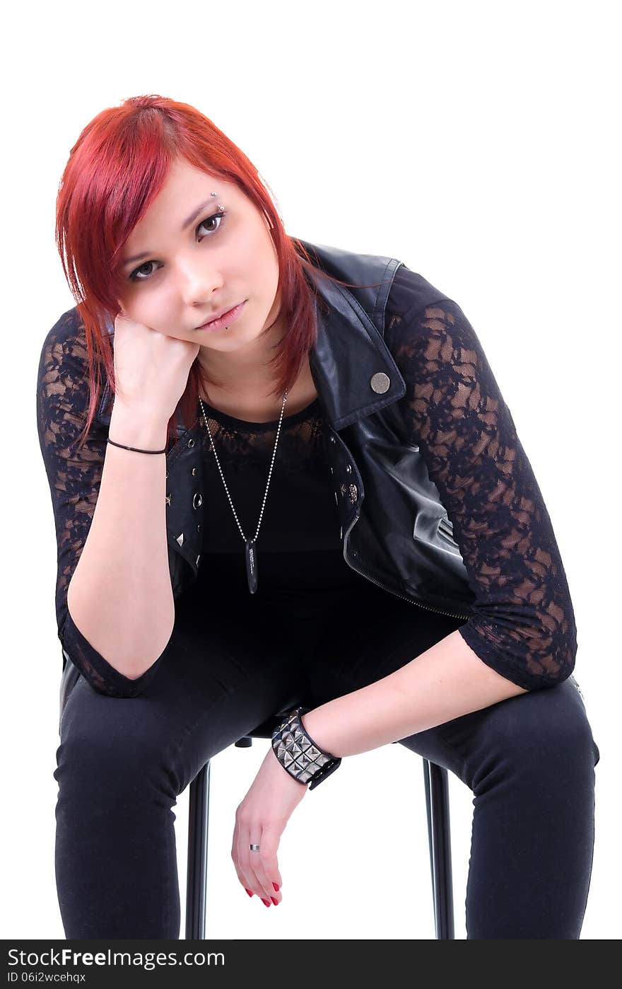 Portrait of thoughtful red haired teenager on a gray background. Portrait of thoughtful red haired teenager on a gray background