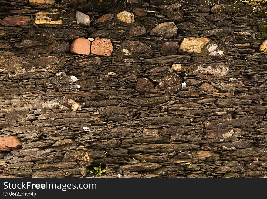 Closeup of 18th century stone wall texture in the historic city of Ouro Preto, Minas Gerais State, Brazil. Closeup of 18th century stone wall texture in the historic city of Ouro Preto, Minas Gerais State, Brazil.