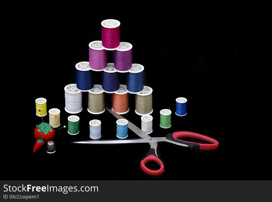 Rolls of thread and other implements of sewing perfection. Rolls of thread and other implements of sewing perfection.