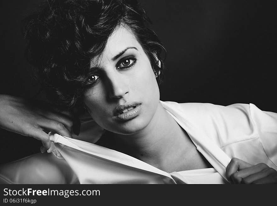 Woman with intense look on black background