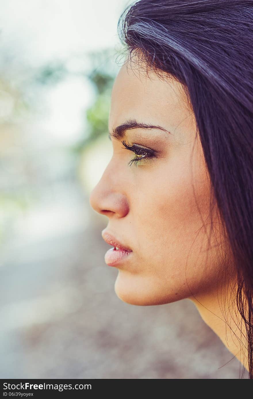 Young woman with green eyes in urban background