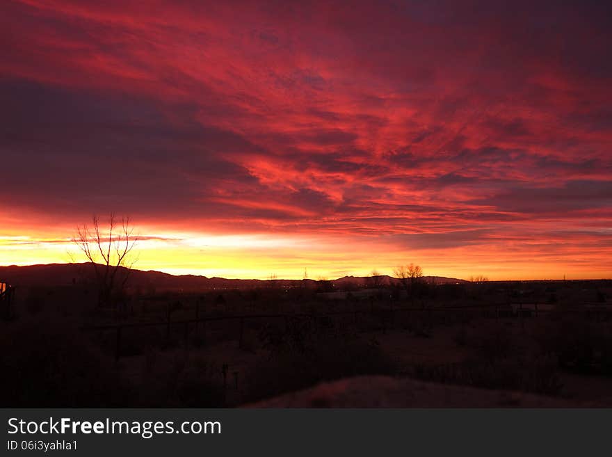 A picture of a bright red and yellow sunrise in New Mexico. A picture of a bright red and yellow sunrise in New Mexico.