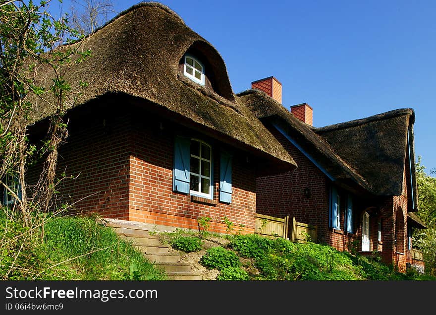 This old thatched-roof farm house can be seen on the Baltic Sea coast of Mecklenburg Vorpommern (Pomerania), Germany