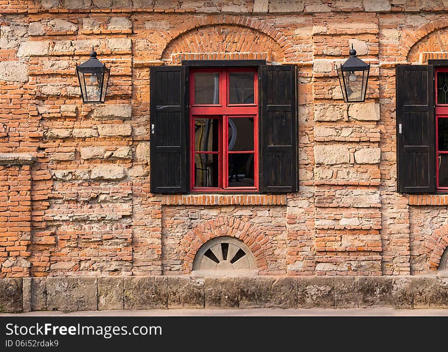 Old window frame on the wall with lantern