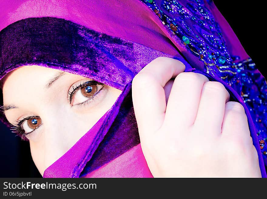 Close-up portrait of a woman with a veil. Close-up portrait of a woman with a veil.