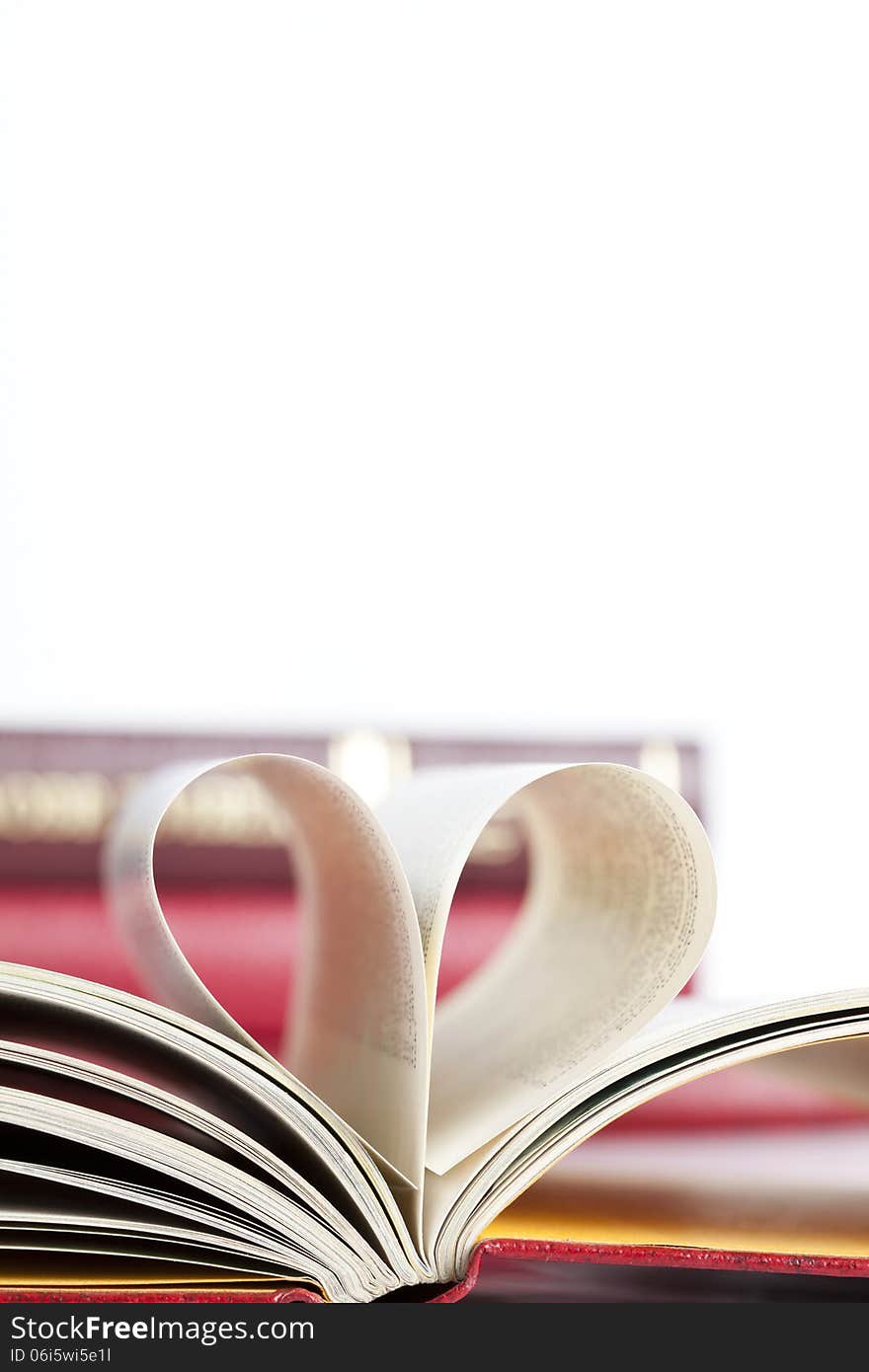 Close up on heart shaped book pages