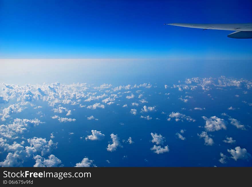 View from the airplane window, ocean blue