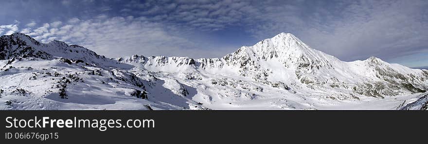 Mountain ridge in winter. panoramic picture composed of stitched images