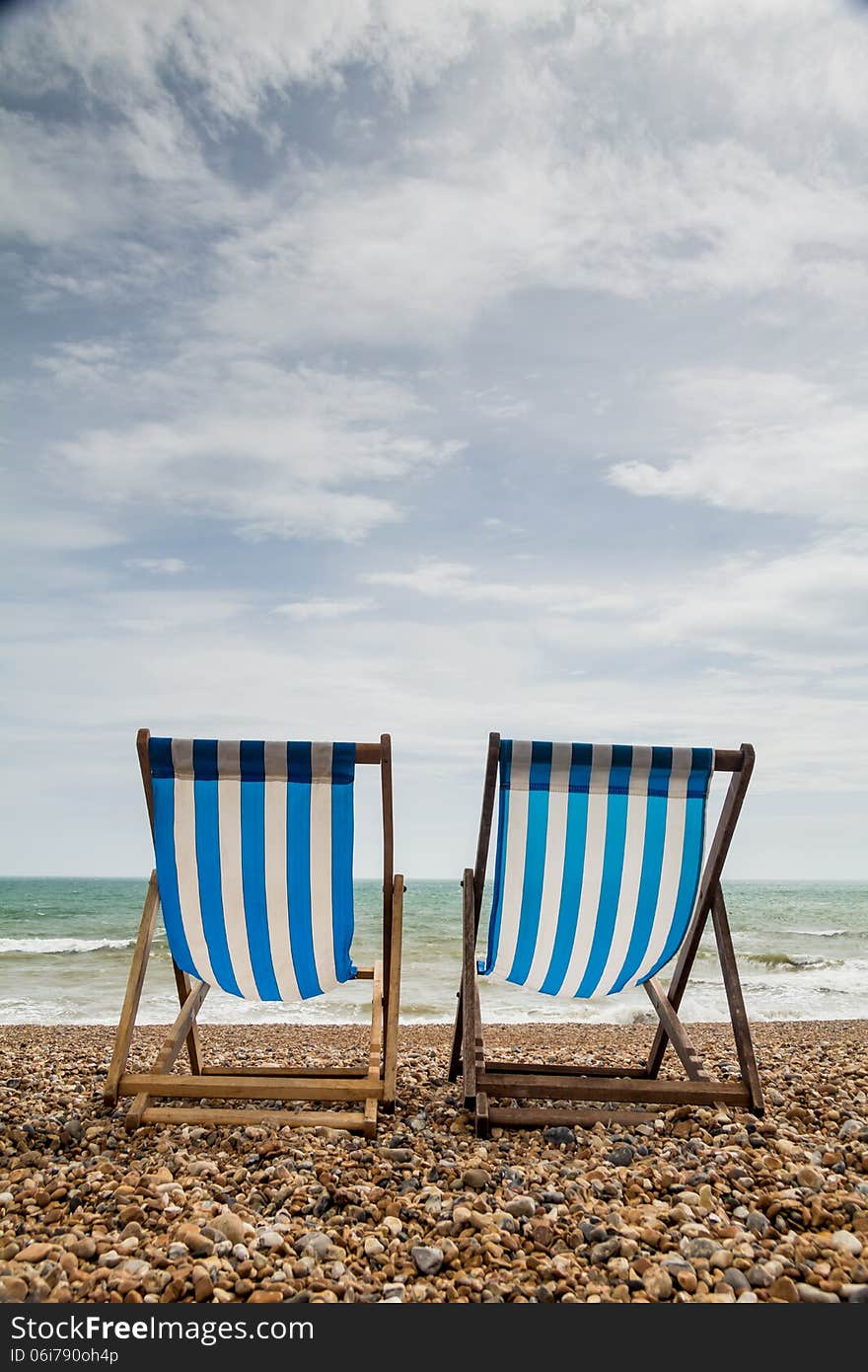 Two Deck Chairs On Brighton Beach, England