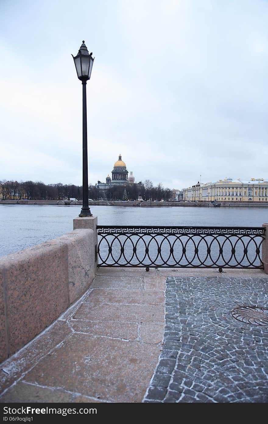 Nice granite embankment with street lamp near Neva river in St. Petersburg, Russia. Nice granite embankment with street lamp near Neva river in St. Petersburg, Russia