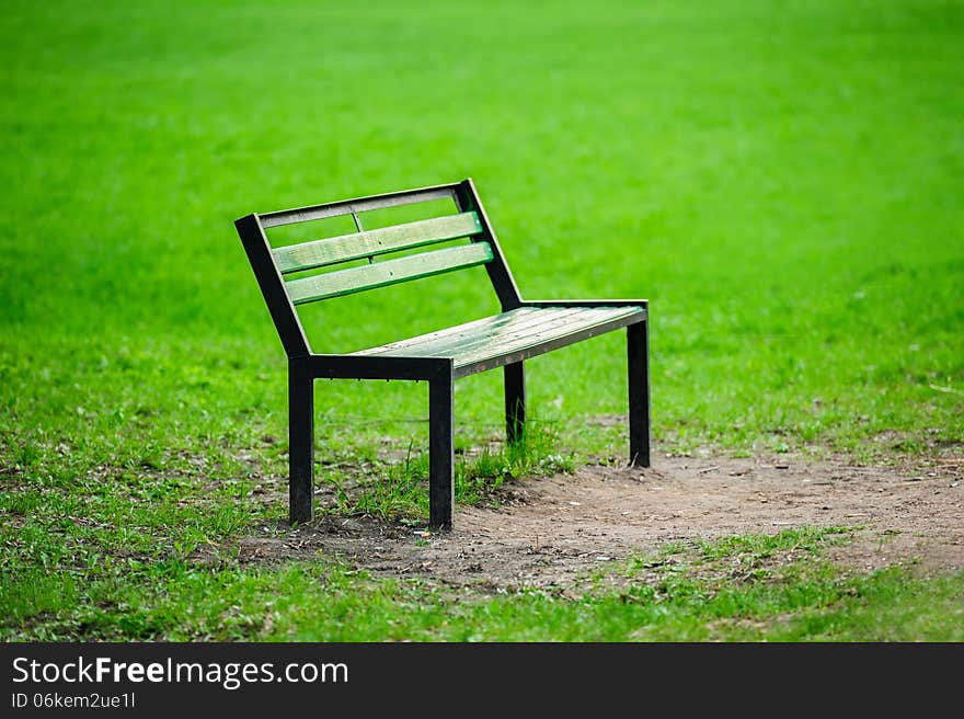 Lonely broken bench in the park