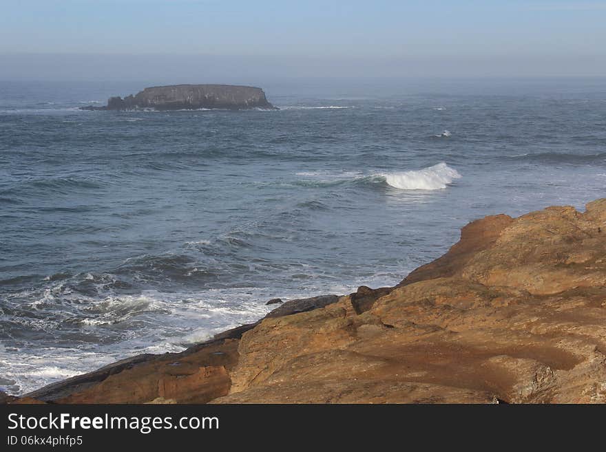 Landscape on the Oregon coast looking out from the Devil's Punch Bowl state park. Landscape on the Oregon coast looking out from the Devil's Punch Bowl state park.