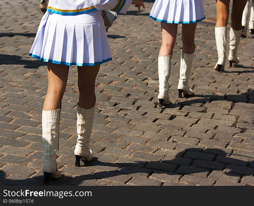 Drummer girls legs on city day on sunny summer day