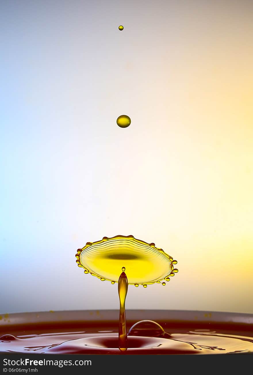 Splashing water drops on color background