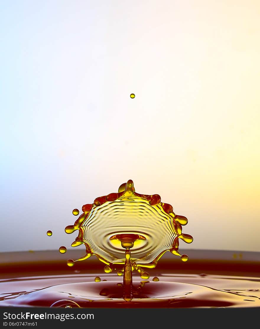 Splashing water drops on color background