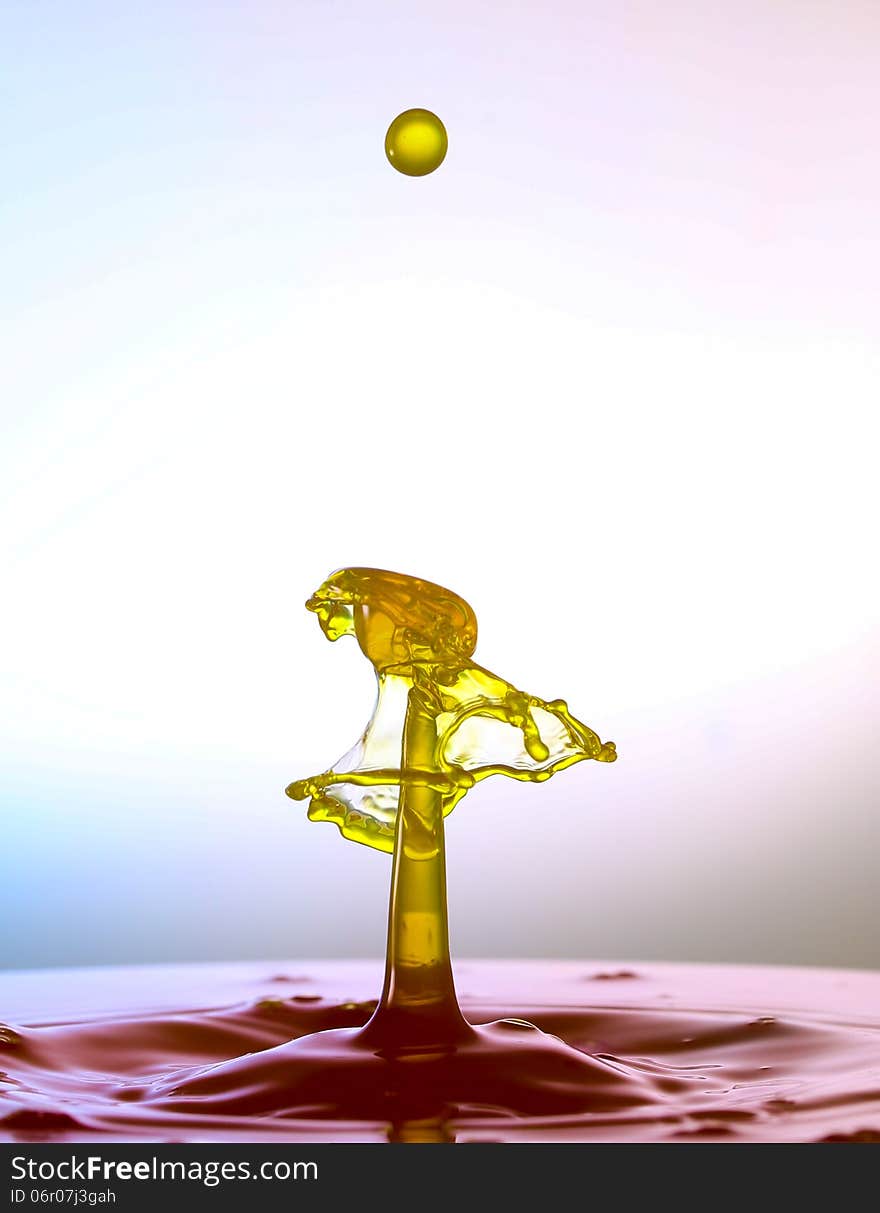 Splashing water drops on color background