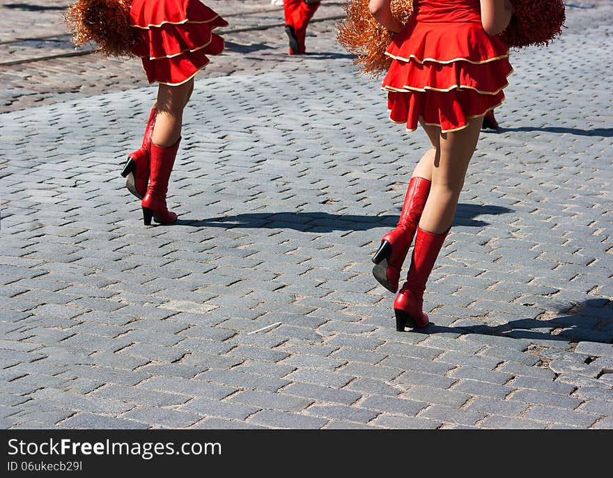 Cheerleaders Marching In City Street