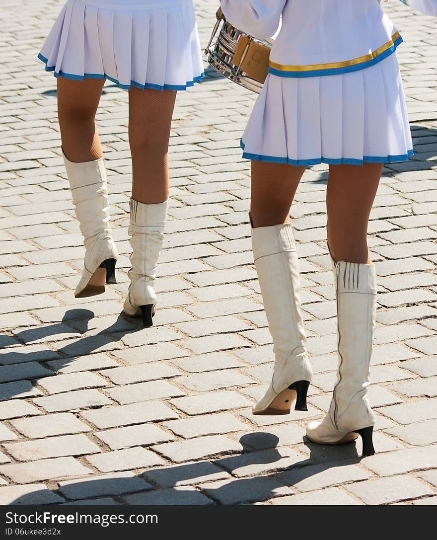 Drummer girls march on city street