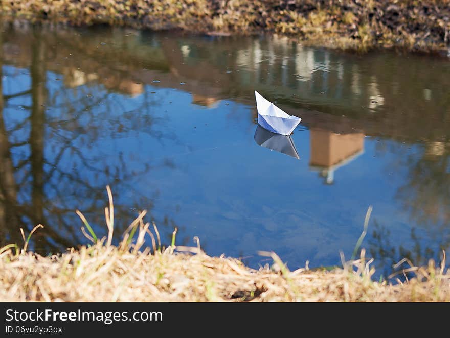 Paper Boat Floating In The Creek