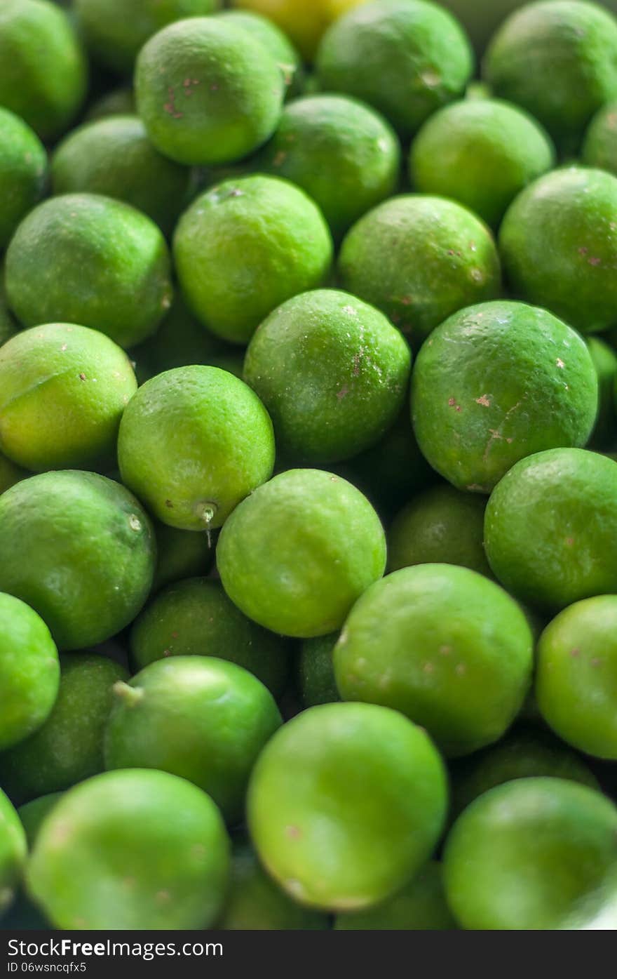 Closeup of green limes with back lighting