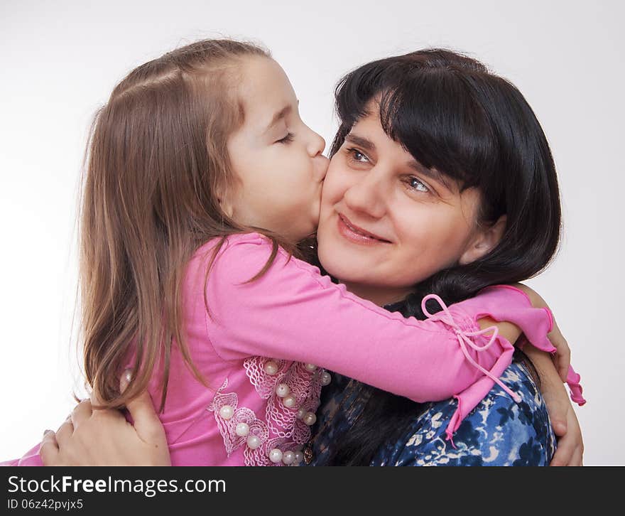 Girl kissing her mother