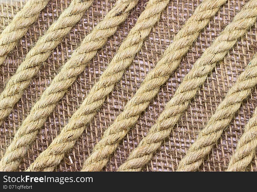 Jute Rope On Burlap Background