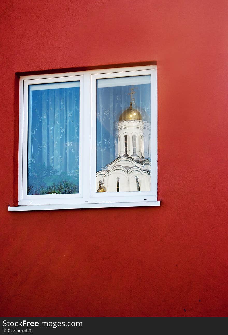 Reflection In The Window Of The Church