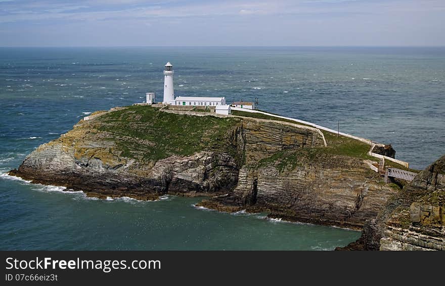 Situated near the north west tip of Wales, the tiny islet known as South Stack Rock lies separated from Holyhead Island by 30 metres of turbulent sea. Situated near the north west tip of Wales, the tiny islet known as South Stack Rock lies separated from Holyhead Island by 30 metres of turbulent sea.