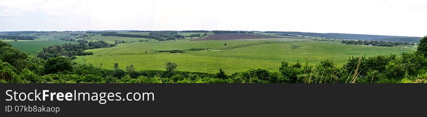 Panorama of natural areas with fields, roads and forest plantations. Panorama of natural areas with fields, roads and forest plantations