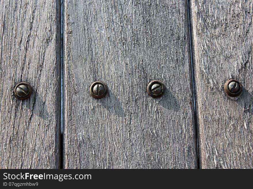 Wood fence with metal screws