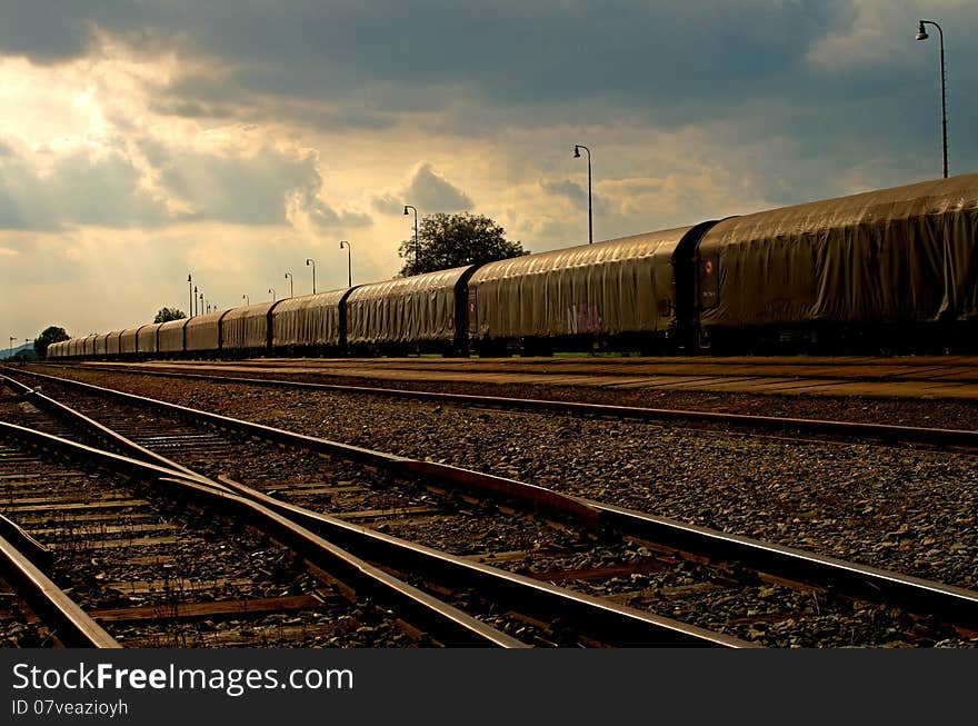 Long train under the evening sky. Long train under the evening sky