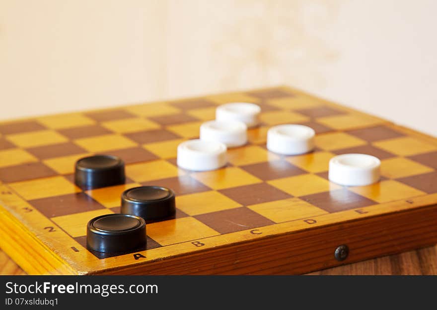 Black and white checkers on a chess board closeup