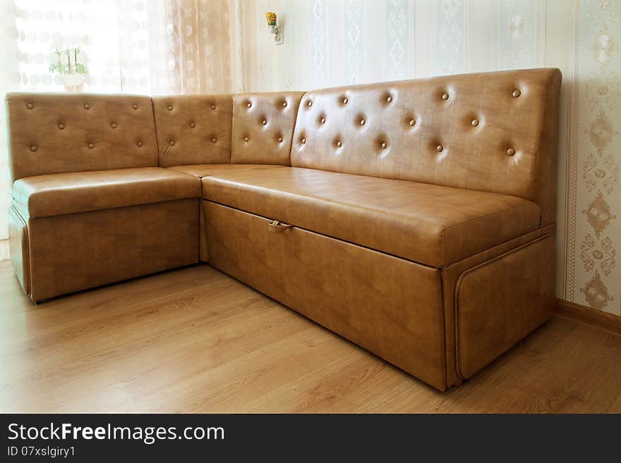 Brown leather sofa in a room closeup