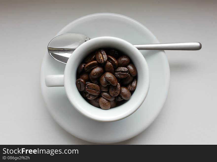 Coffe beans in coffee cup