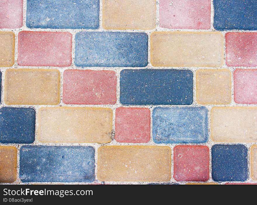 Colored background and texture from paving slabs outside