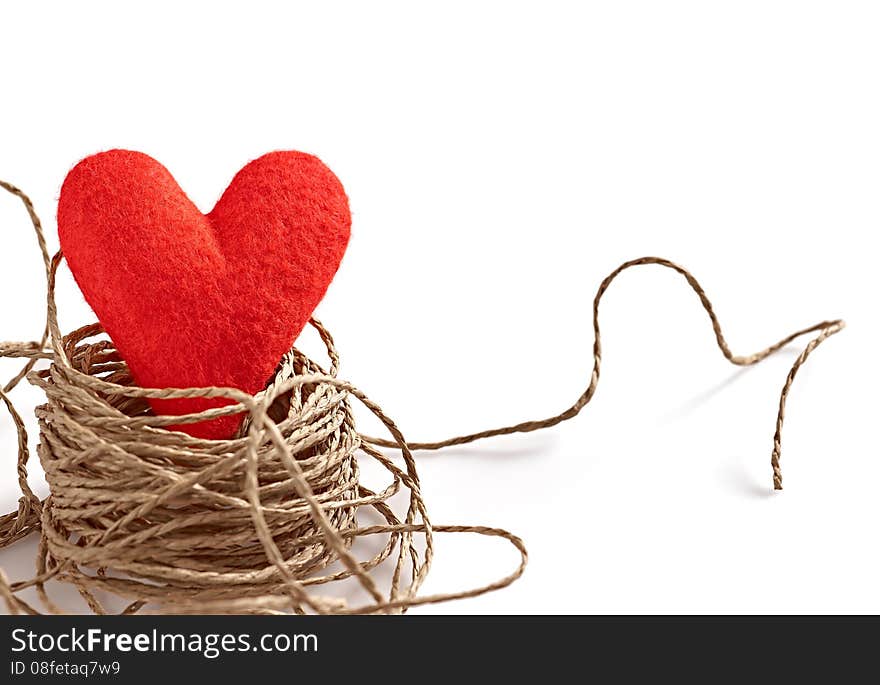 Love heart, Valentines Day. Handmade of red felt alone in nest. Vivid creative unusual greeting card, copyspace. Romantic, isolated on white. Love heart, Valentines Day. Handmade of red felt alone in nest. Vivid creative unusual greeting card, copyspace. Romantic, isolated on white