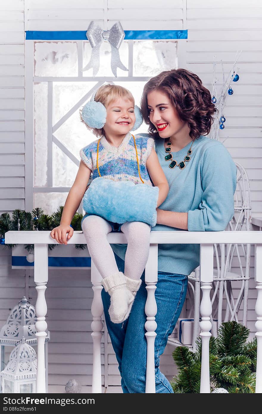 Smiling Little Girl With Her Older Sister Standing Next To A Chr