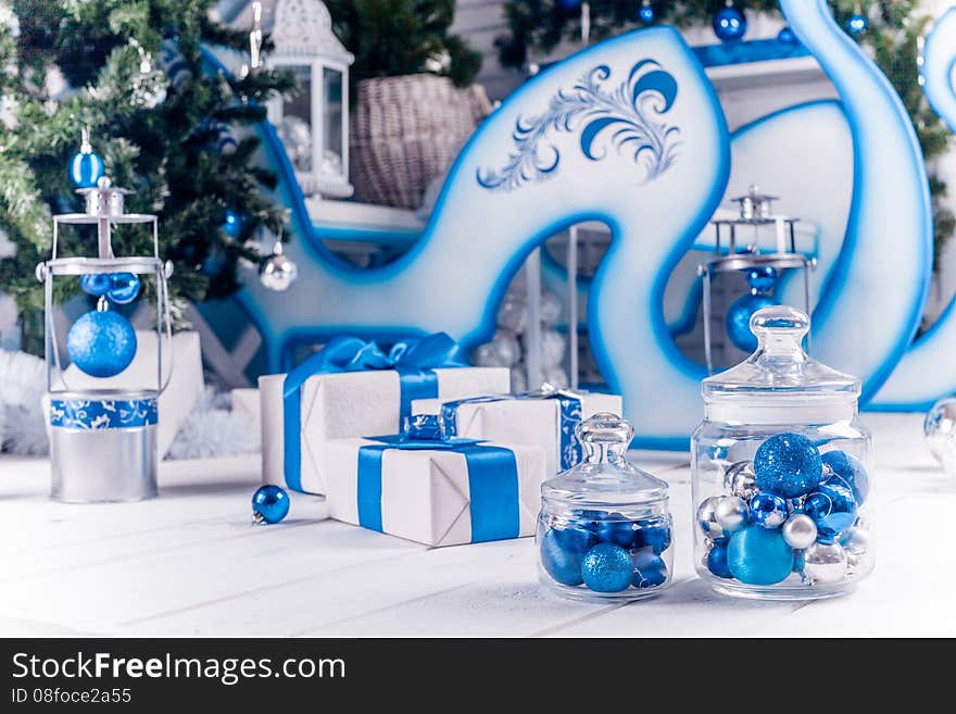 White Christmas gifts with blue ribbons