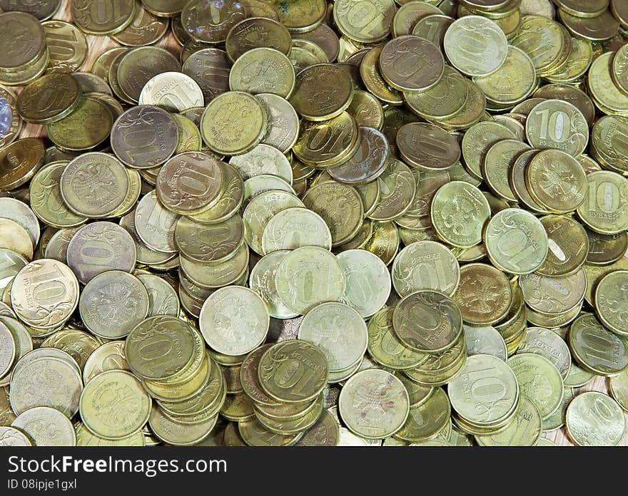 Many russian ten ruble coins on the floor. Many russian ten ruble coins on the floor