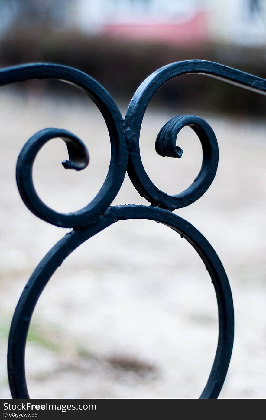 Wrought fence.Elements of the fence.curls